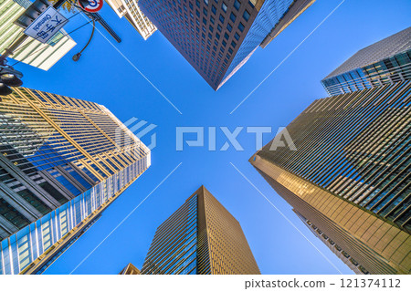 Tokyo cityscape in Japan, end of the year. Skyscrapers in Otemachi. Low sunlight envelopes the office buildings in soft light (22nd) 121374112