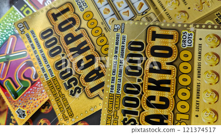 Scratch-off lottery tickets at a table 121374517