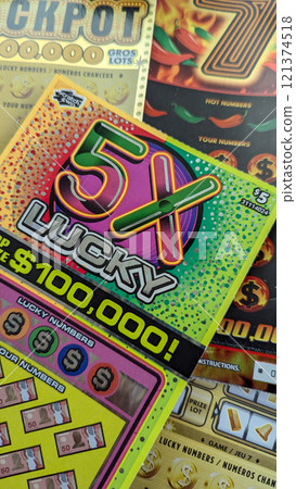Scratch-off lottery tickets at a table 121374518