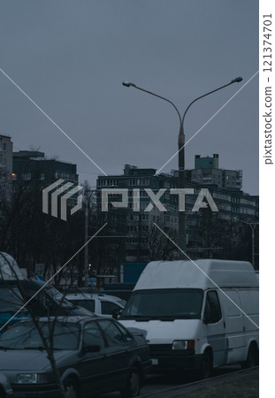 Grey, Soviet panels in the distance in the evening. Minsk in the evening 121374701