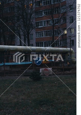 Water supply repair works in the city. Construction site in the evening 121374702