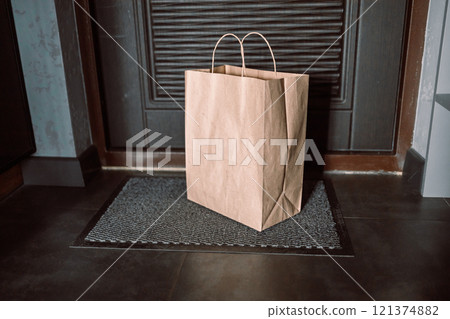 Contactless delivery. Apartment entrance with delivered box. Control Epidemic Prevention measures of coronavirus Contactless delivery. Apartment entrance with delivered box. Control Epidemic Prevention measures of coronavirus 121374882