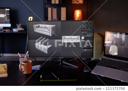 Monitors displaying 3D models of a sofa, alongside various software tools and options Photographed in well-lit modern office, with laptop, notebook, and coffee mug on desk 121375700