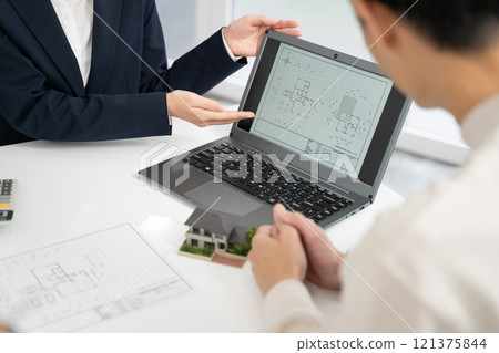 Businesswomen discussing house design 121375844