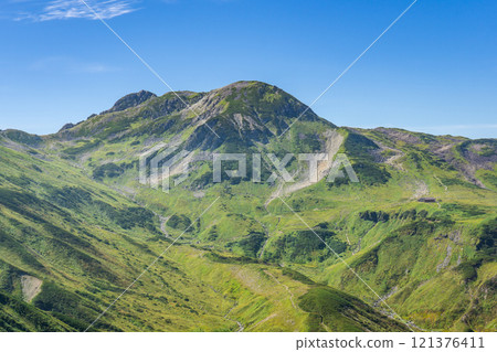 Mount Jodo and Mount Ryuo seen from the Raichozawa hiking trail. Climbing Mount Tsurugi in the Northern Alps 121376411