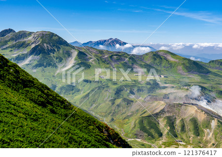 Murododaira and Mt. Yakushi seen from the Raichozawa hiking trail. Climbing Mt. Tsurugi in the Northern Alps Murododaira and Mt. Yakushi seen from the Raichozawa hiking trail. Climbing Mt. Tsurugi in the Northern Alps 121376417