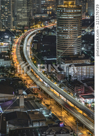 Night scene of light trails of cars on the road of Bangkok city. Night scene of light trails of cars on the road of Bangkok city. 121376739