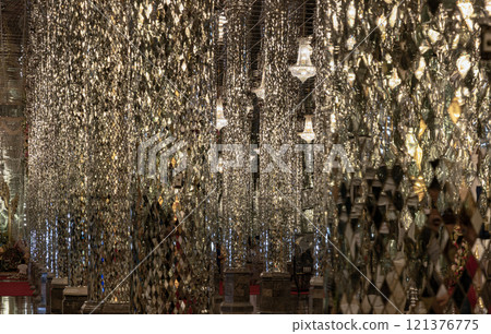 View of Chandeliers ceiling reflection of Shining golden glittering lighting. 121376775