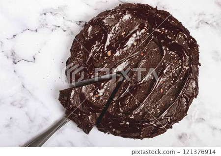 chocolate cake, round cake, on a marble light table, top view, homemade cakes, no people, chocolate cake, round cake, on a marble light table, top view, homemade cakes, no people, 121376914