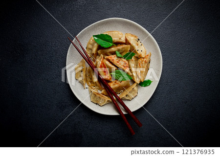 japanese fried dumplings, gyoza, sesame seeds, top view, no people, 121376935