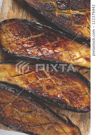 sliced fried eggplant, on a chopping board, top view, homemade, no people, 121376942