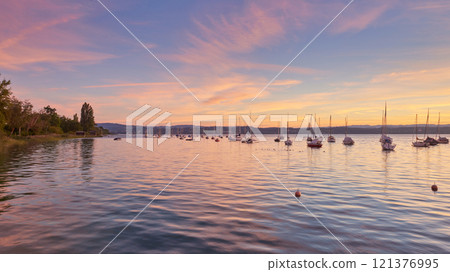 Bodensee Lake Sunrise Panorama. Morning Sunlight Over Tranquil Waters. 121376995