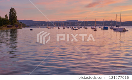 Bodensee Lake Sunset Panorama. Evening Sunlight Over Tranquil Waters. Sunset Vista at Lake Bodensee in Germany. 121377016