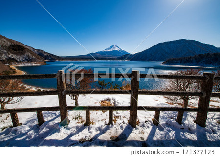 Mountain Fuji and lake Motosu with blue sky in winter season, Japan 121377123