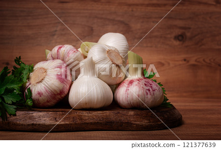Fresh young garlic, white and purple color, on a wooden table, no people, Fresh young garlic, white and purple color, on a wooden table, no people, 121377639