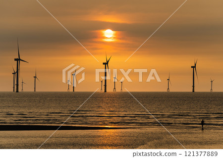 Sunset view of the Offshore wind power systems off the western coast of Taiwan. Sunset view of the Offshore wind power systems off the western coast of Taiwan. 121377889