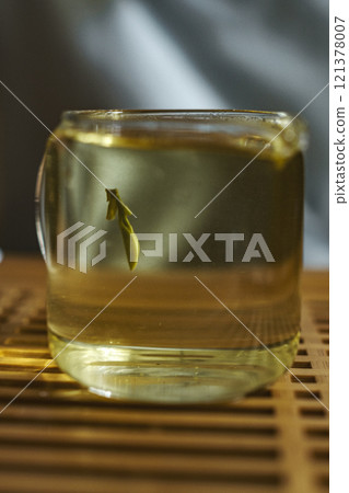 A Distinctive Fish Gracefully Swimming in a Transparent Glass Jar Filled with Water A Distinctive Fish Gracefully Swimming in a Transparent Glass Jar Filled with Water 121378007
