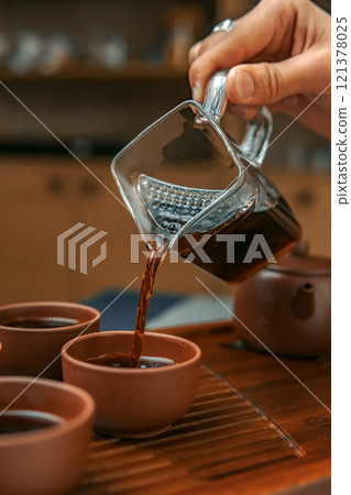 Creating the Perfect Tea Experience Within a Cozy, Warm, and Inviting Setting to Delight in 121378025
