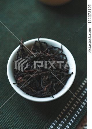 Loose Black Tea Leaves Beautifully Arranged in a Bowl for Your Enjoyment and Brewing 121378105