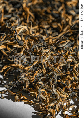 A textured background of dried loose leaf tea, highlighting its unique beauty and characteristics 121378106