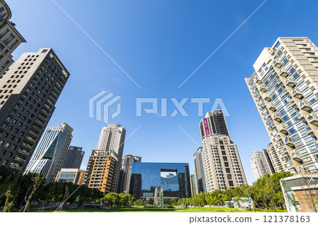 View of the park and surrounding modern buildings in front of Taichung City Council, Taiwan. 121378163