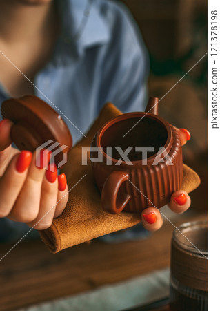 A Sophisticated Teapot with Cozy Styling in Warm Tones enhances any dining experience A Sophisticated Teapot with Cozy Styling in Warm Tones enhances any dining experience 121378198