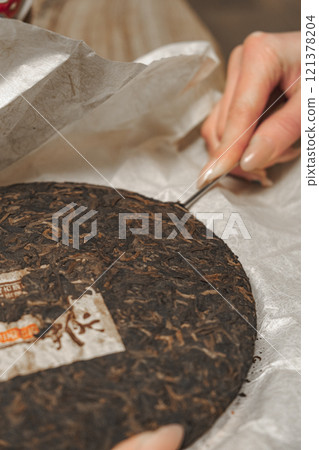 The preparation of tea cake with the use of traditional and vintage tools is enchanting 121378204