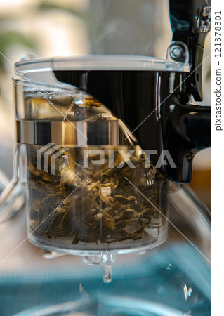 Herbal Tea Infuser with Fresh Ingredients for Brewing deliciously aromatic beverages at home 121378301