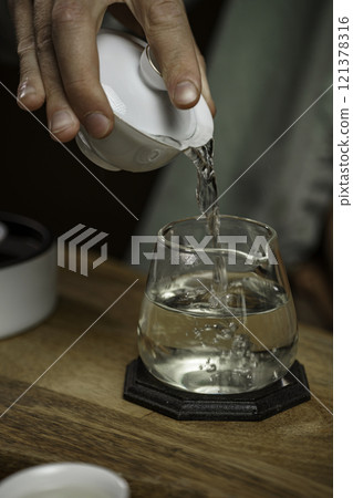 The Art of Pouring Water into a Glass An Elegant and Mindful Tea Preparation Ritual The Art of Pouring Water into a Glass An Elegant and Mindful Tea Preparation Ritual 121378316