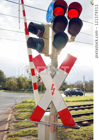 Railway crossing with traffic lights. 121379313