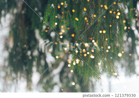 Christmas tree outdoor with lights and snow Christmas tree outdoor with lights and snow 121379330