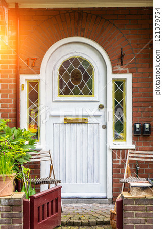 Typical dutch door. Dutch holland architectural detail, a door in Netherlands city. Dutch door Typical dutch door. Dutch holland architectural detail, a door in Netherlands city. Dutch door 121379754