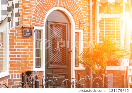 Typical dutch door. Dutch holland architectural detail, a door in Netherlands city. Dutch door Typical dutch door. Dutch holland architectural detail, a door in Netherlands city. Dutch door 121379755
