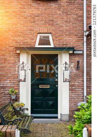 Typical dutch door. Dutch holland architectural detail, a door in Netherlands city. Dutch door Typical dutch door. Dutch holland architectural detail, a door in Netherlands city. Dutch door 121379763