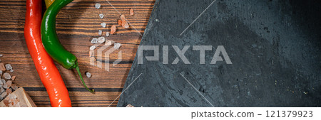 rustic steak cutting board with rosemary and spices , dark rustic wooden background, top view, place for text 121379923