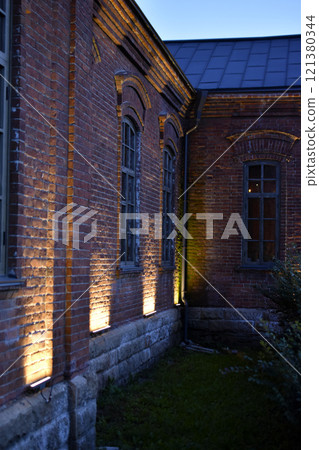 Classic windows in a red brick house. Beautiful classic brick house. Classic windows in a red brick house. Beautiful classic brick house. 121380344
