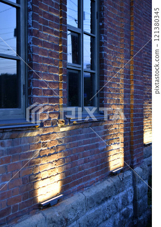 Classic windows in a red brick house. Beautiful classic brick house. 121380345