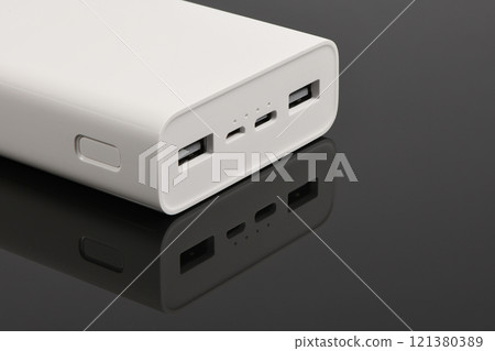 White power bank on black background. 121380389