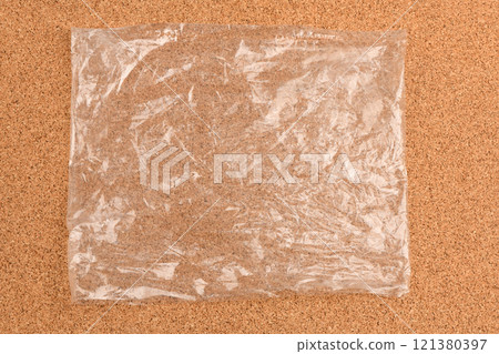 Packaging bag on cork background. Packaging bag on cork background. 121380397