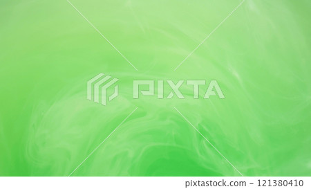 Light emulsion. Liquid paint. Defocused bright green color cloud ink mist vortex vapor steam moving on abstract art background. 121380410