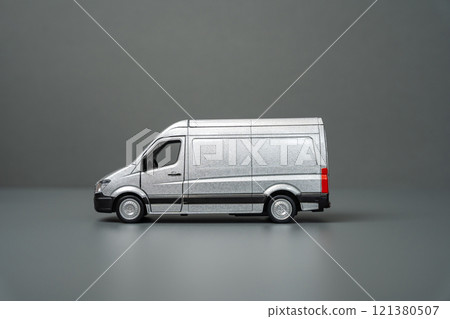 Gray delivery van side view. Copy space. Place for text. Local delivery and transportation of goods. Logistics, supply. Transport industry. Gray delivery van side view. Copy space. Place for text. Local delivery and transportation of goods. Logistics, supply. Transport industry. 121380507