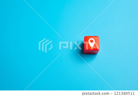 Red block with geolocation symbol on a blue background. Search for new places to travel. Guide on interesting destinations. Advertising and awareness. Red block with geolocation symbol on a blue background. Search for new places to travel. Guide on interesting destinations. Advertising and awareness. 121380511