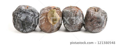 Mummified rotten apples. Rotten apples on white. Spoiled apples crop. 121380548
