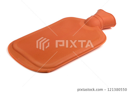 Rubber orange heating pad. Orange rubber heating pad isolated on a white background. Extreme closeup. 121380550