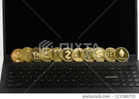 Golden Cryptocurrency on keyboard laptop, Bitcoin , Ethereum, Litecoin, Dashcoin, XRP, EOS, NEO, TRX, Monero, Zcach, Iota and Ripple coins. Golden Cryptocurrency on keyboard laptop, Bitcoin , Ethereum, Litecoin, Dashcoin, XRP, EOS, NEO, TRX, Monero, Zcach, Iota and Ripple coins. 121380735
