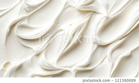 Abstract close-up of soft white flowing texture resembling fabric or cream. 121380889