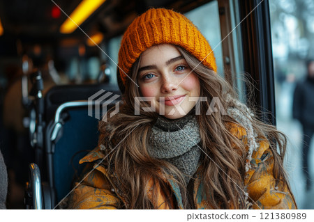 Girl in wheelchair rides public transport with  specially equipped platform. 121380989