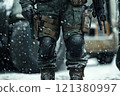 Legs of soldier in winter gear with knee pads. 121380997