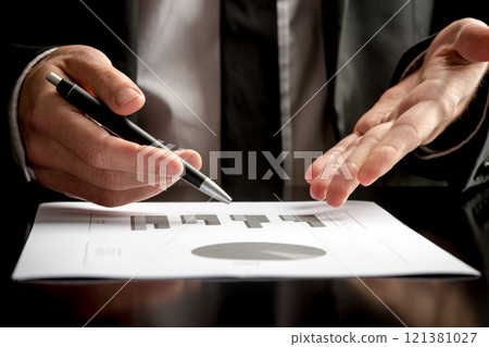 Businessman in a meeting or presentation Businessman in a meeting or presentation 121381027