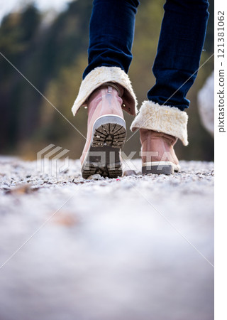 Closeup of a woman walking along a rural path Closeup of a woman walking along a rural path 121381062